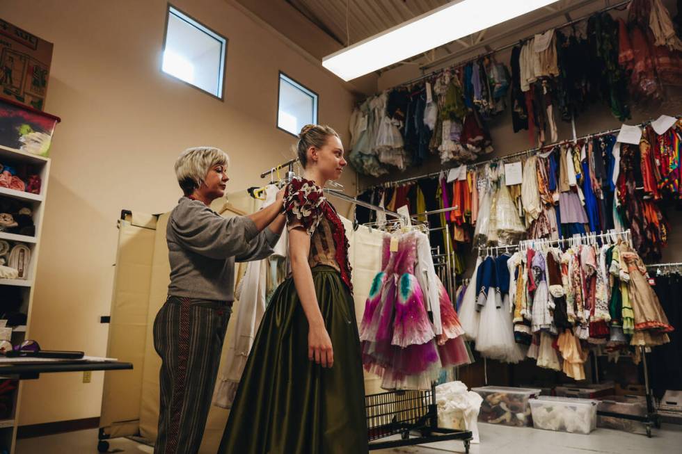 Nevada Ballet Theatre wardrobe coordinator Amanda Williams, left, fits dancer Madeline Diehl fo ...