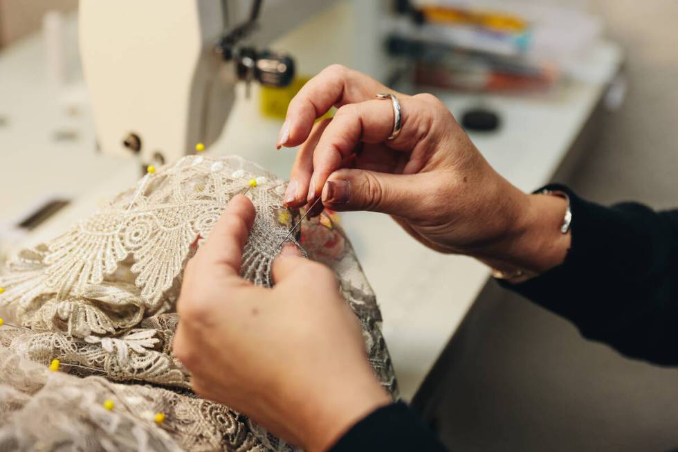 A seamstress for the Nevada Ballet works on a costume for the Nutcracker at the Nevada Ballet T ...