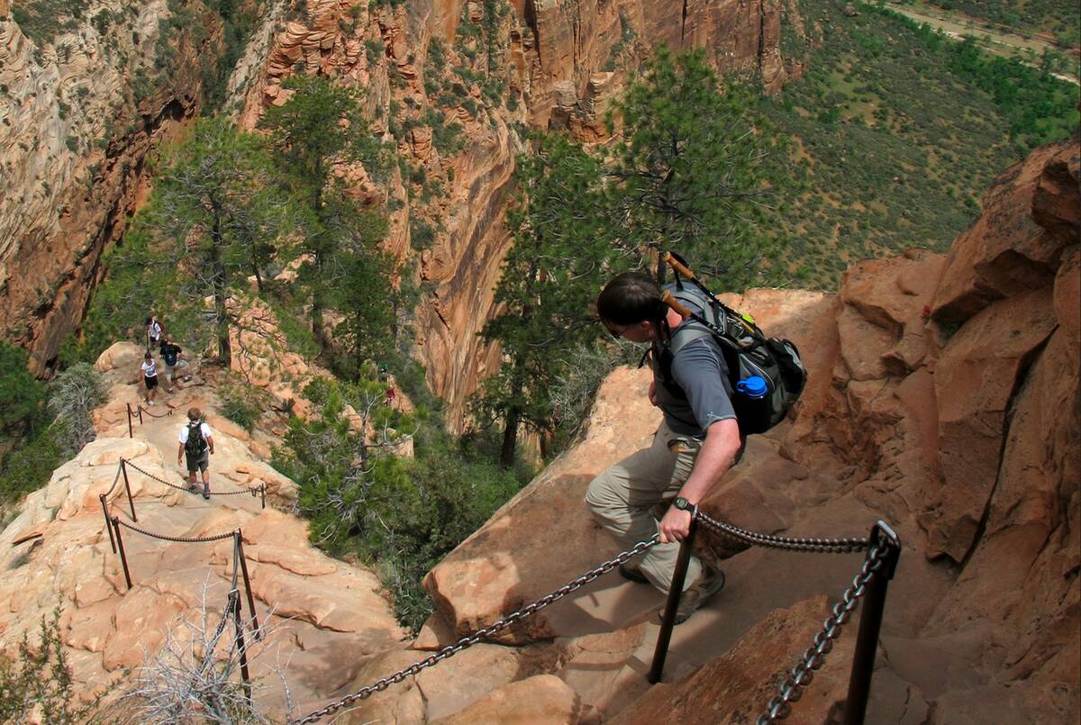 Hikers climb down the Angels Landing trail in Zion National Park in Utah in May 2021. (Jud Burk ...
