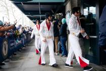 The Vegas Golden Knights arrive dressed like Elvis before the NHL Winter Classic hockey game ag ...