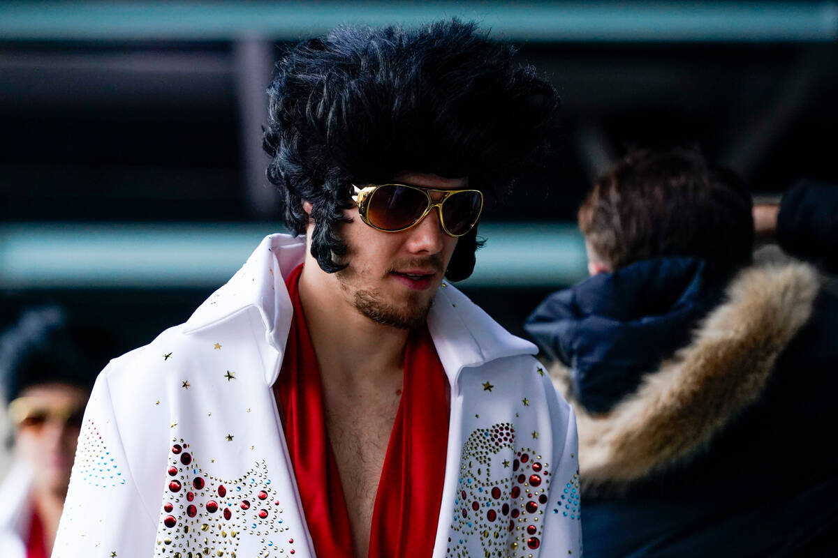 Vegas Golden Knights players arrive dressed in Elvis outfits before the NHL Winter Classic hock ...