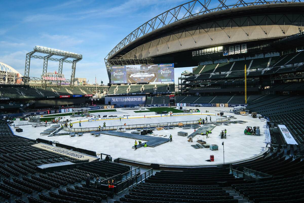 Construction of the rink for the New Year's Day NHL hockey Winter Classic between the Seattle K ...