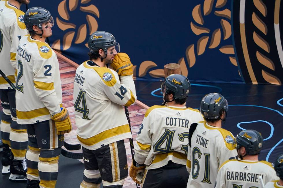 Vegas Golden Knights defenseman Nicolas Hague (14) talks with center Paul Cotter (43) as they l ...