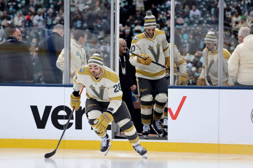 Vegas Golden Knights left wing William Carrier (28) leads center Nicolas Roy (10) to the ice fo ...