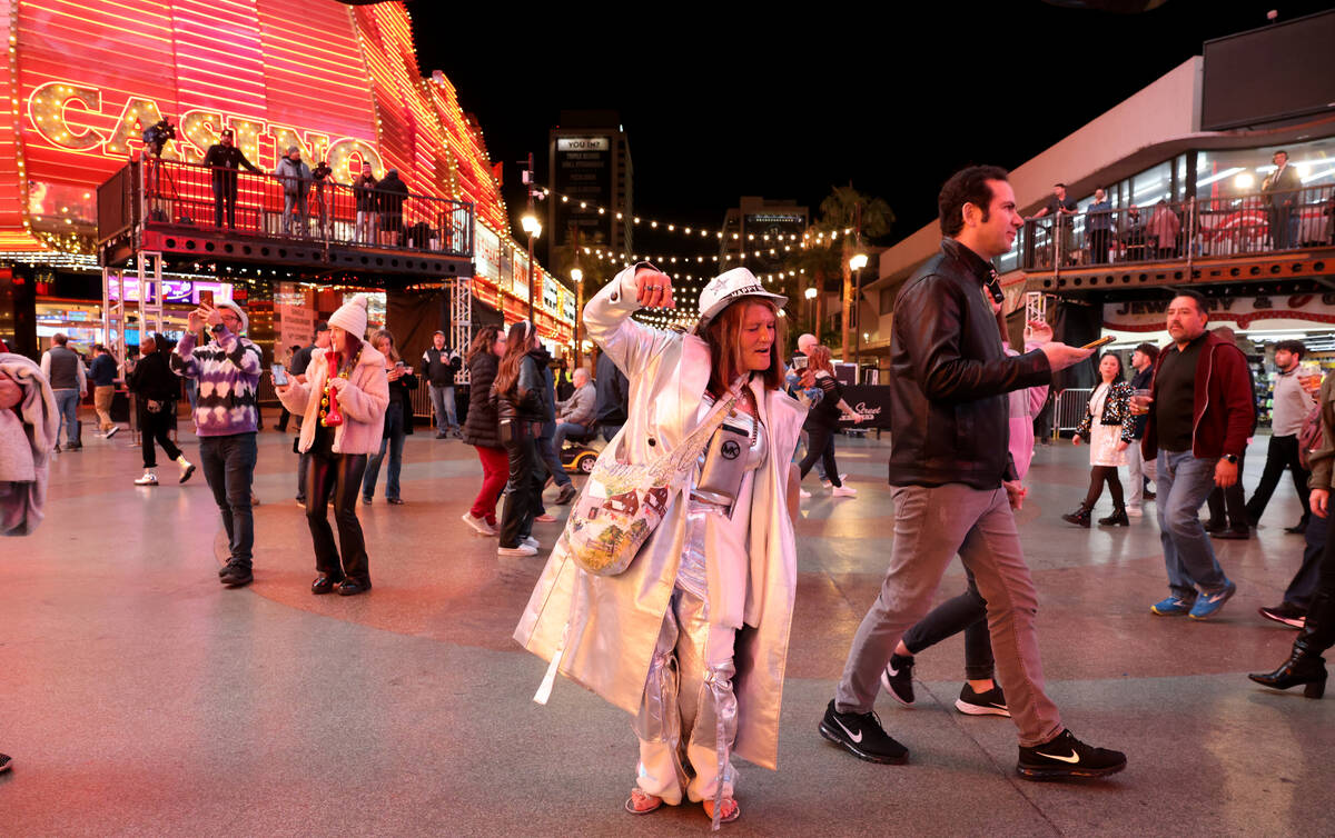 New Year’s Eve revelers, including Elizabeth Martinez of Las Vegas, center, celebrate during ...