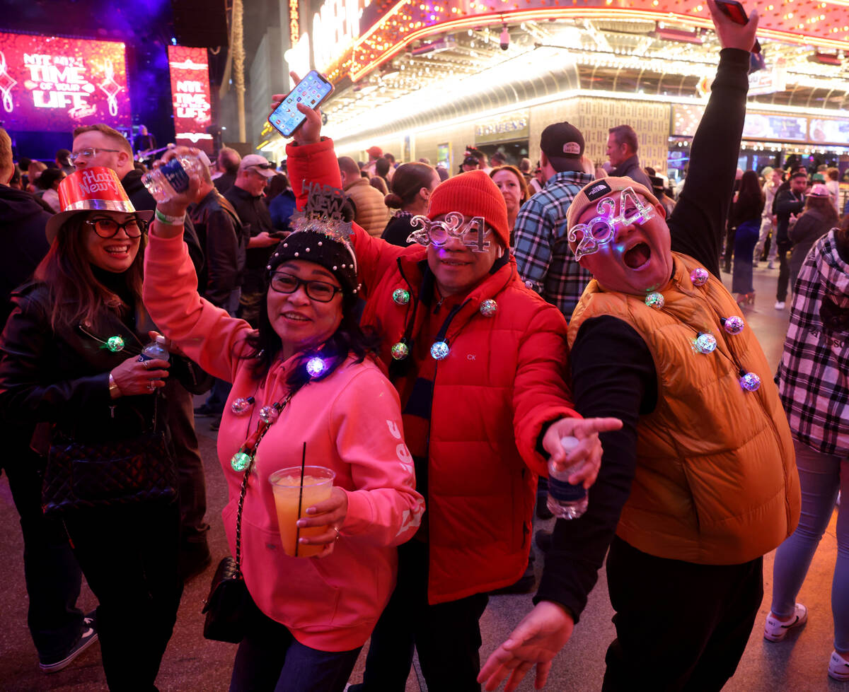New Year’s Eve revelers, including from left, Josephine Cabal of Hilo, Hawaii, Haide Fal ...