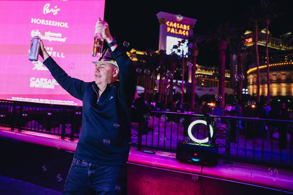 New Year revelers dance in front of Harrah’s on Sunday, Dec. 31, 2023, in Las Vegas. (Ma ...