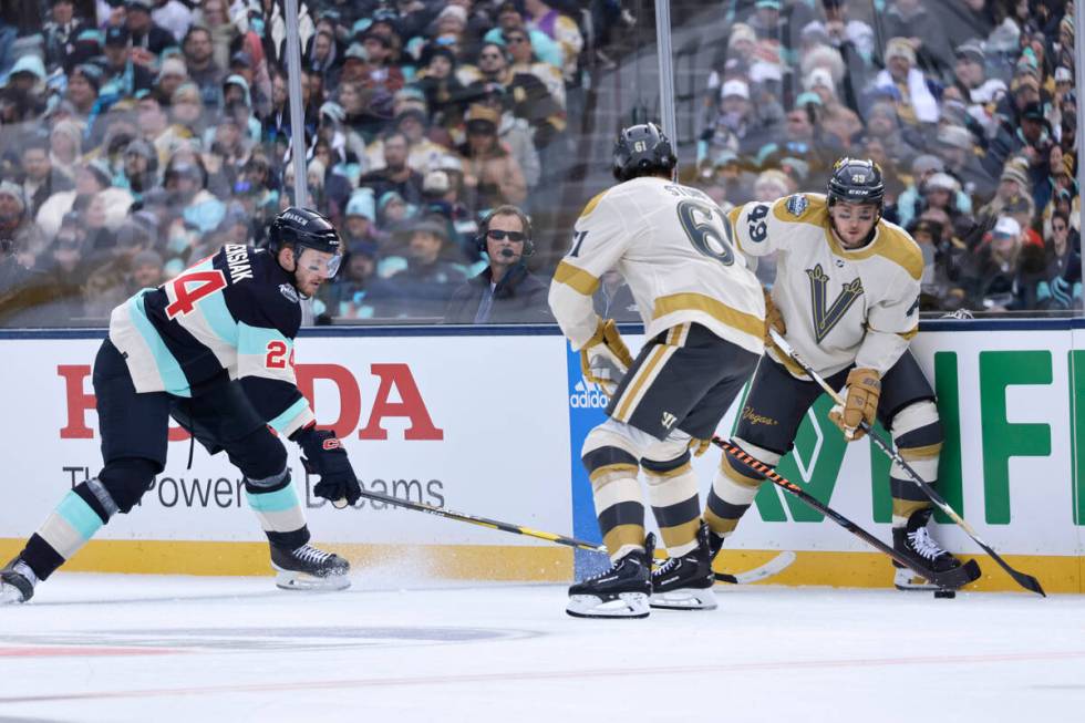 Vegas Golden Knights center Ivan Barbashev (49), right wing Mark Stone (61) and Seattle Kraken ...