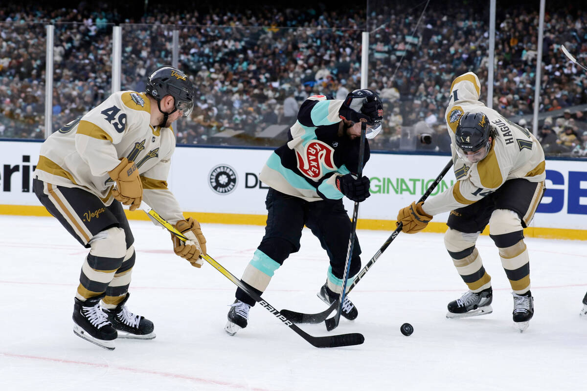 Seattle Kraken left wing Tomas Tatar (90), battles for the puck with Vegas Golden Knights cente ...