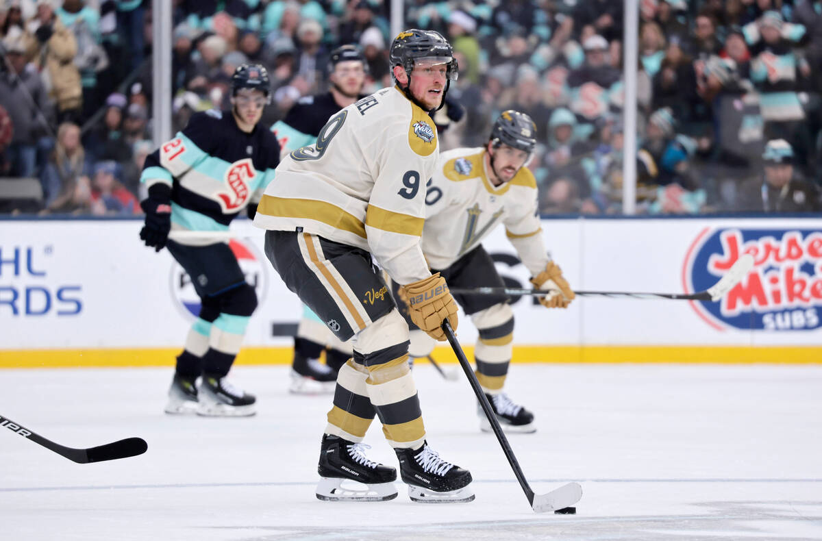 Vegas Golden Knights center Jack Eichel (9) brings the puck down the ice against the Seattle Kr ...