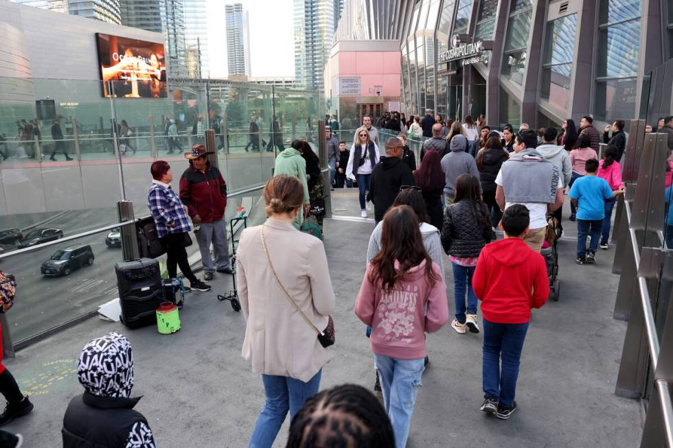 Entertainers play music on a pedestrian bridge over the Strip at Harmon Avenue in Las Vegas on ...