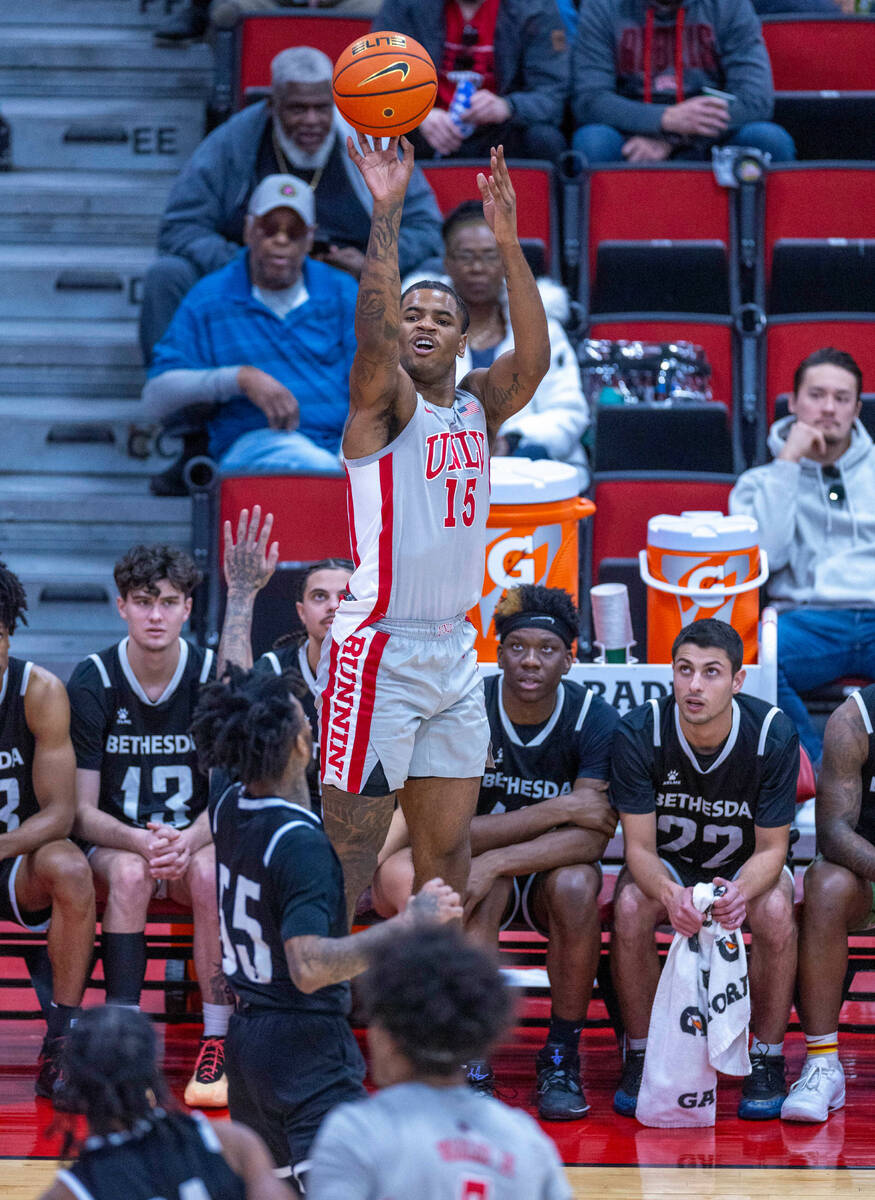 UNLV Rebels guard Luis Rodriguez (15) elevates for a three-point basket over Bethesda Universit ...