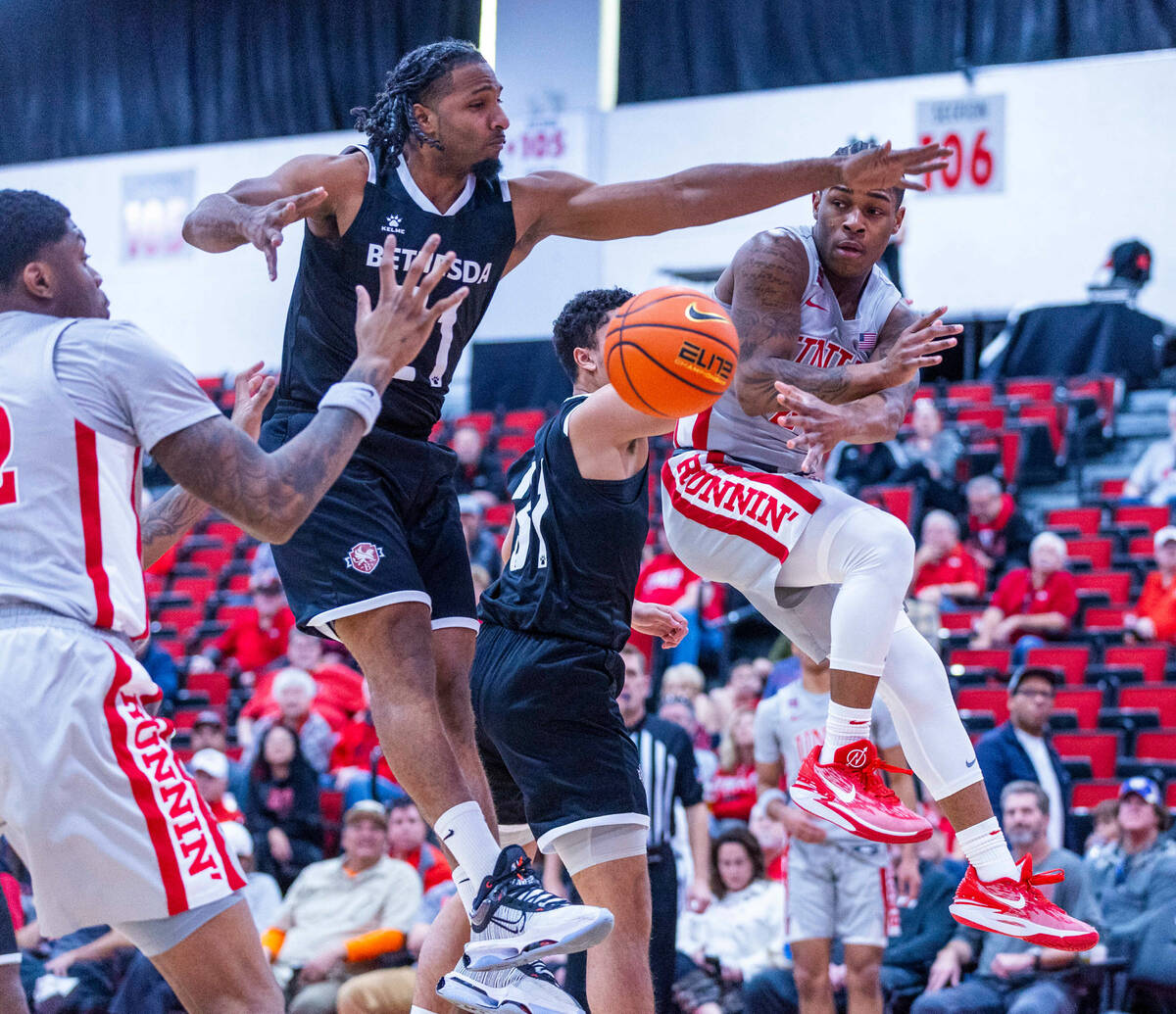 UNLV Rebels guard Justin Webster (2) sends a pass to a teammate near the basket past Bethesda U ...