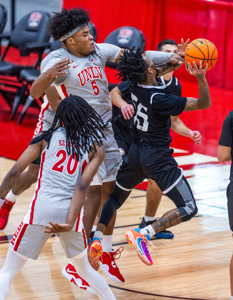 UNLV Rebels forward Rob Whaley Jr. (5) attempts to block a shot by Bethesda University Flames g ...