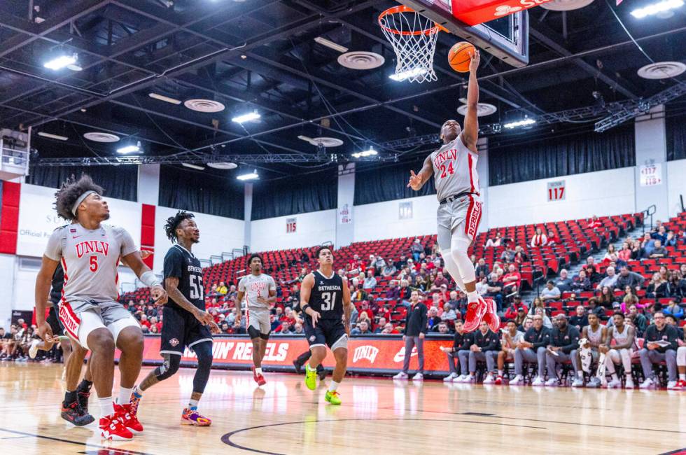 UNLV Rebels guard Jackie Johnson III (24) breaks away for a lay up against the Bethesda Univers ...