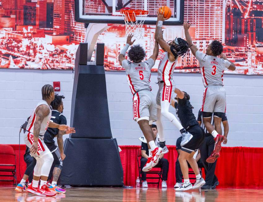 UNLV Rebels forward Rob Whaley Jr. (5), forward Keylan Boone (20) and guard Shane Nowell (3) te ...