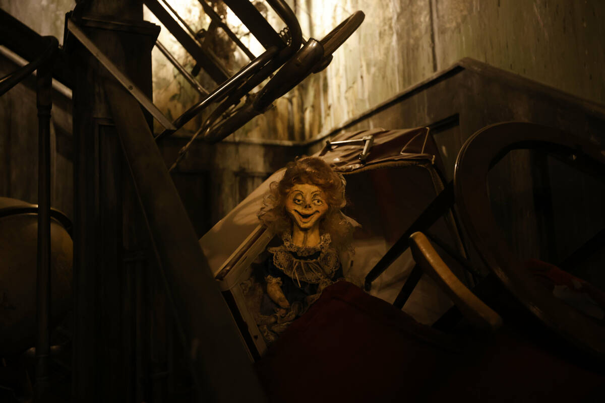 A doll is seen on the set of Neibolt House living room at Escape IT, Tuesday, April 11, 2023, i ...