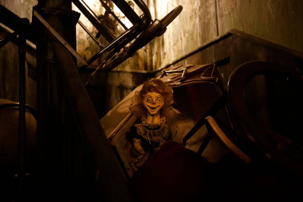 A doll is seen on the set of Neibolt House living room at Escape IT, Tuesday, April 11, 2023, i ...