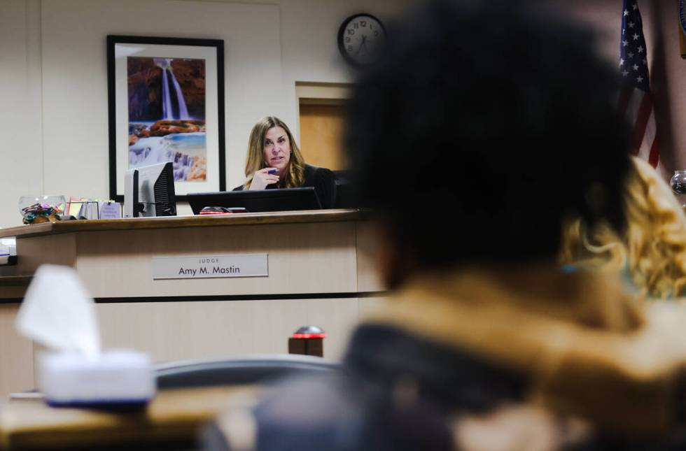 Clark County Family Court Judge Amy Mastin addresses the mother of one of the juveniles arreste ...