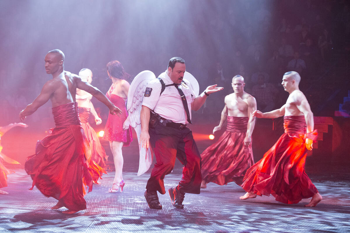 Paul Blart (Kevin James) on stage with "Le Reve" performers in "Paul Blart: Mall Cop 2." (Colum ...