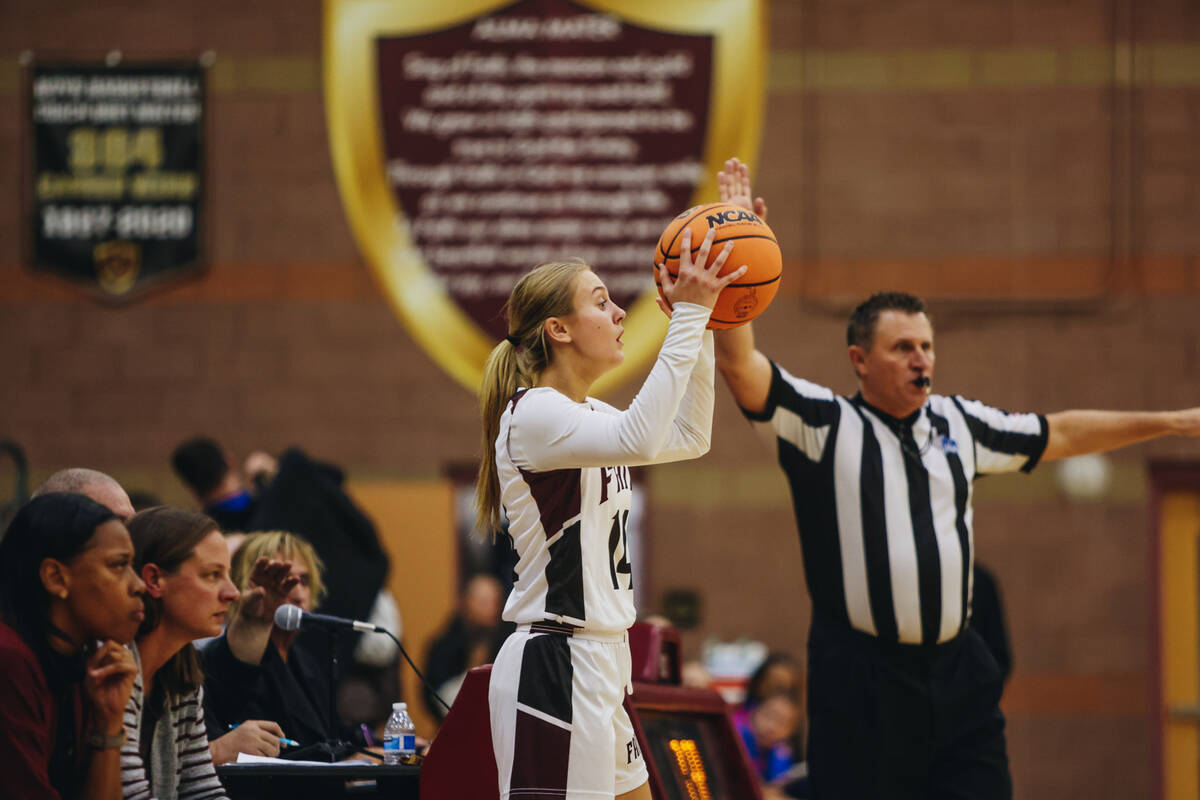 Faith Lutheran’s Kloe Abdalla yells to a teammate as she looks to pass the ball during a ...