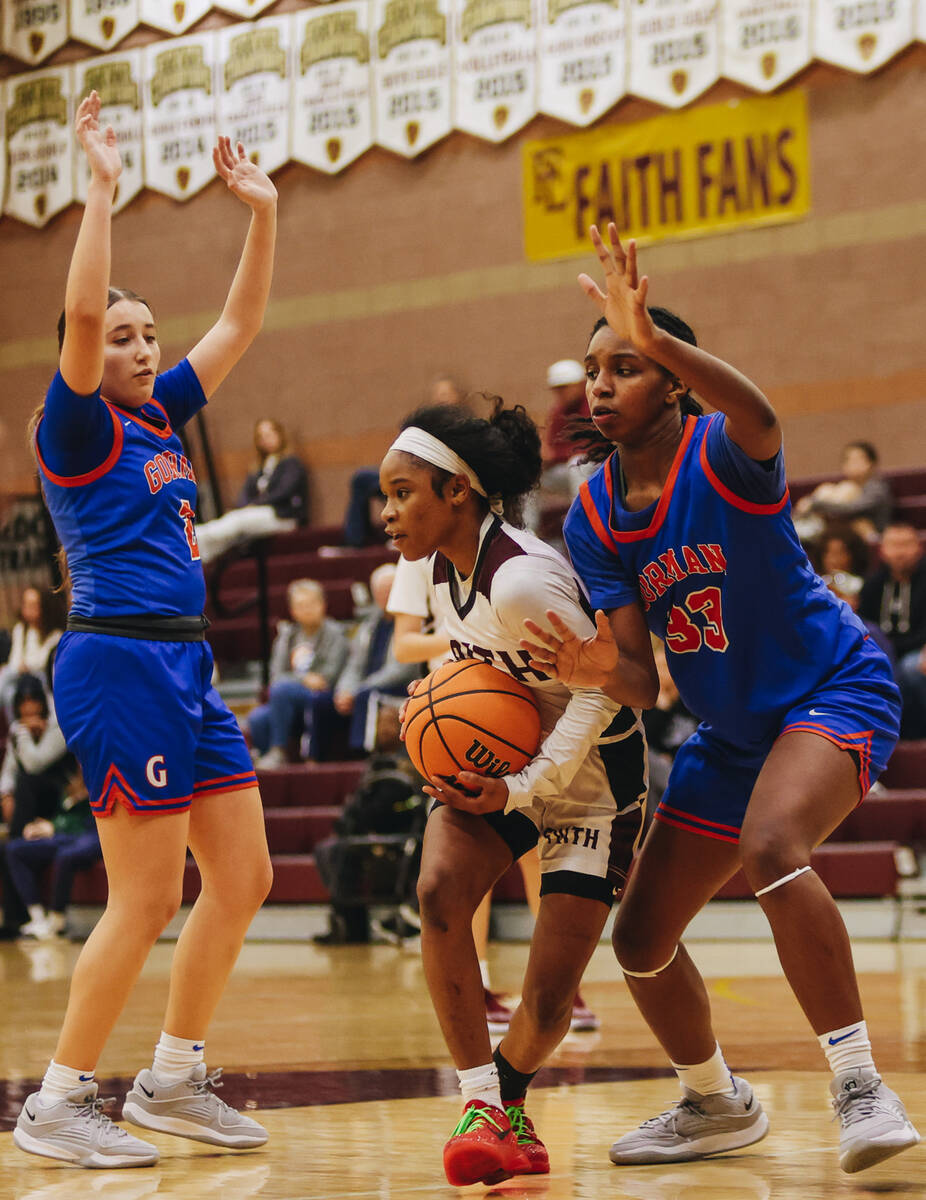 Faith Lutheran’s Tamiah Harrison (4) moves the ball to a teammate during a game against ...