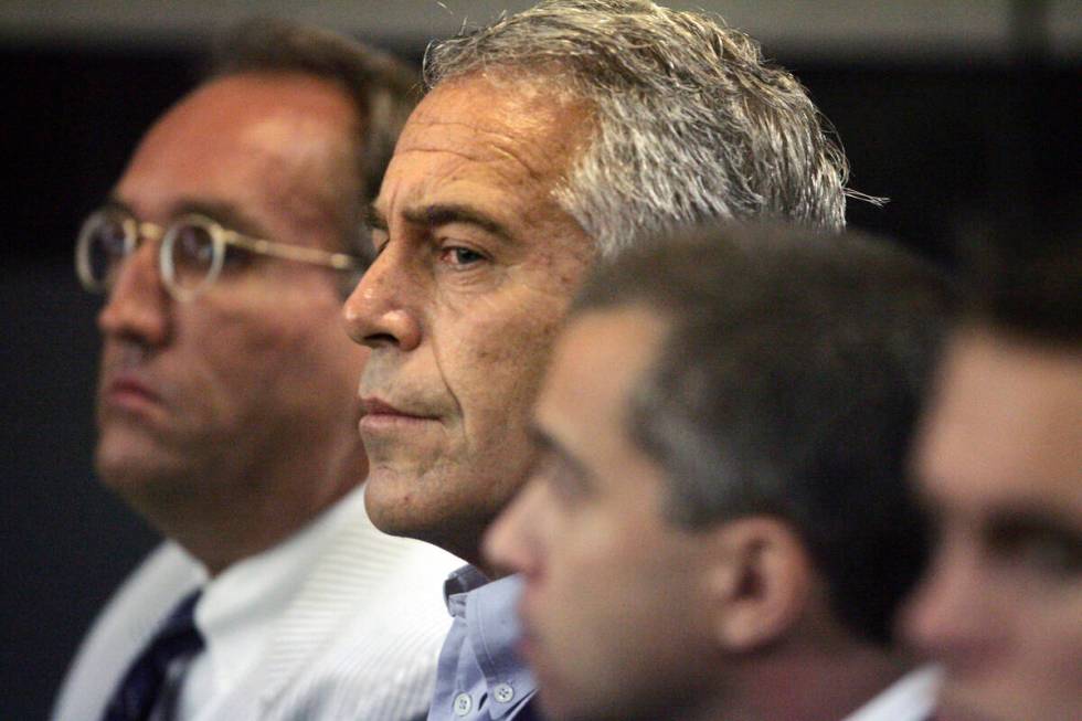 FILE- Jeffrey Epstein appears in court in West Palm Beach, Fla., July 30, 2008. The Justice Dep ...