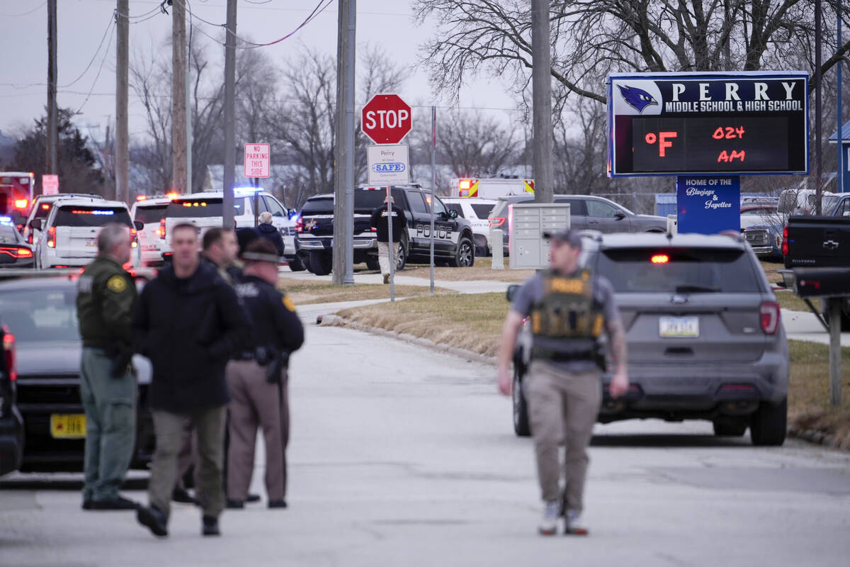 Police respond to Perry High School in Perry, Iowa., Thursday, Jan. 4, 2024. Police say there h ...