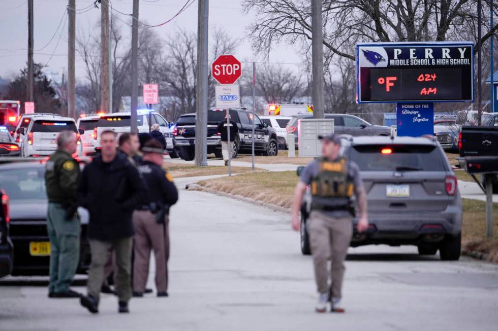 Police respond to Perry High School in Perry, Iowa., Thursday, Jan. 4, 2024. Police say there h ...