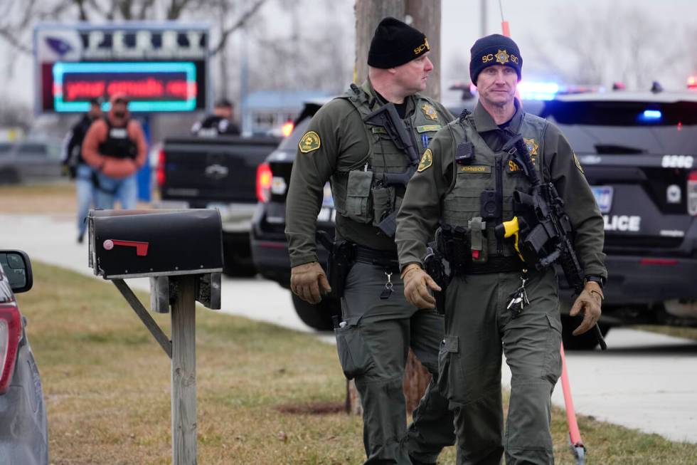 Police respond to Perry High School in Perry, Iowa., Thursday, Jan. 4, 2024. Police say there h ...