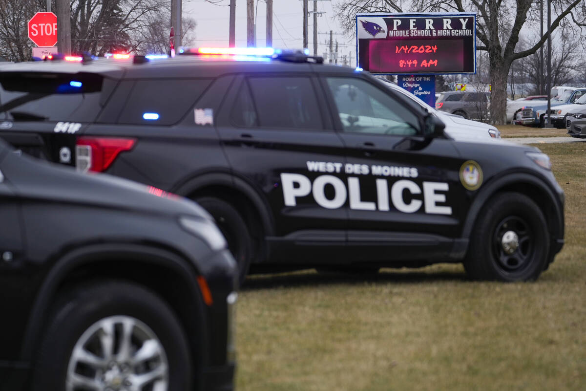 Police respond to Perry High School in Perry, Iowa., Thursday, Jan. 4, 2024. Police say there h ...