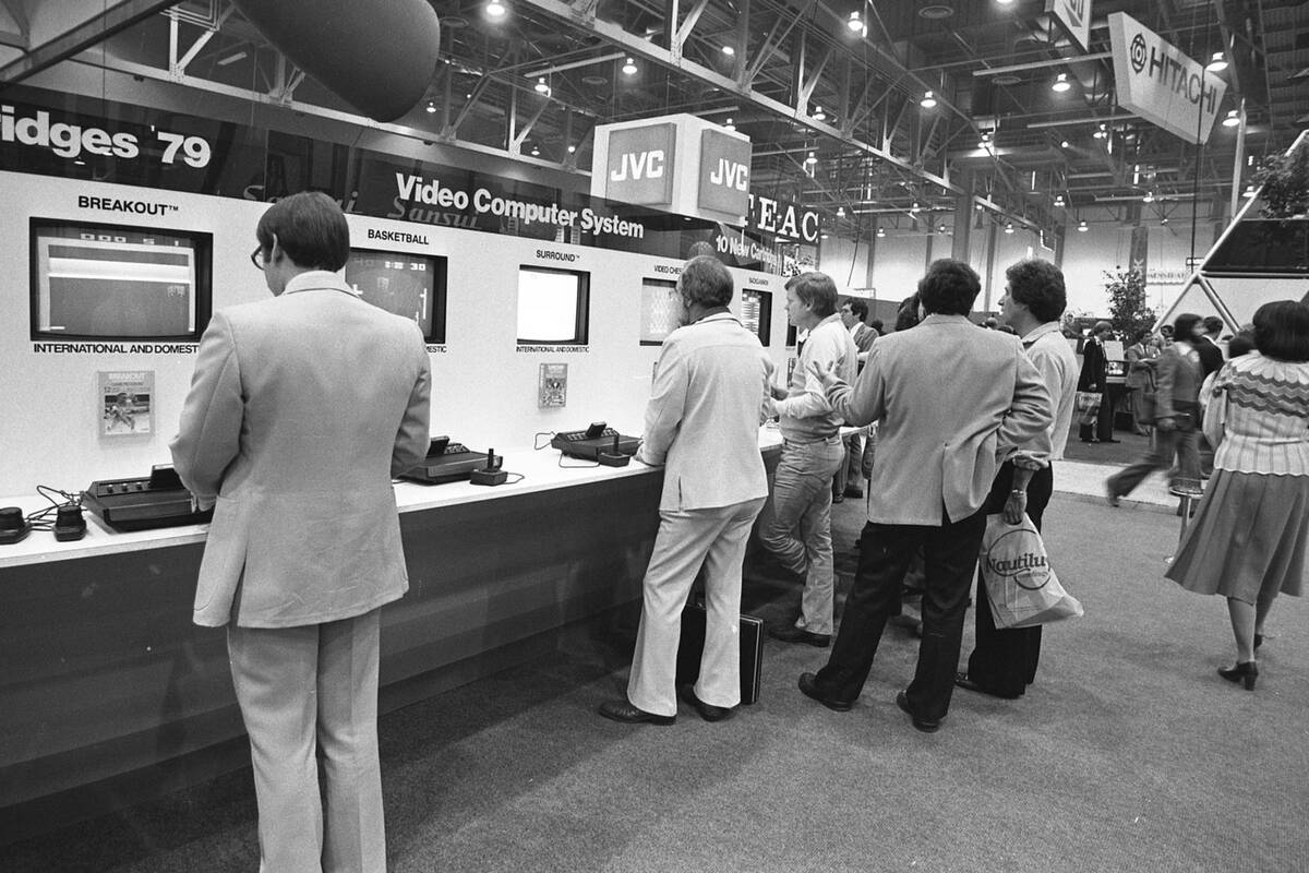 Attendees play Atari video games during the 2nd International CES show January 7, 1979, at the ...