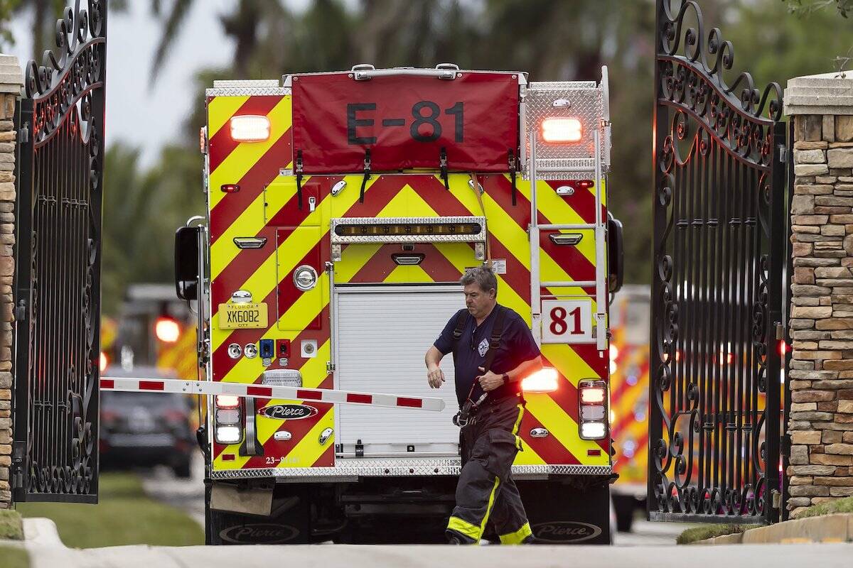 First responders work an active fire inside the Landmark Ranch Estates neighborhood on Wednesda ...