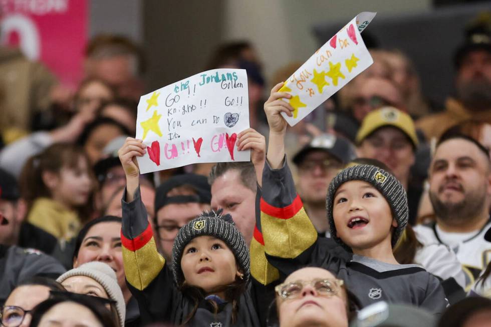 Young Vegas Golden Knights cans cheer on their team during an NHL game against the Florida Pant ...