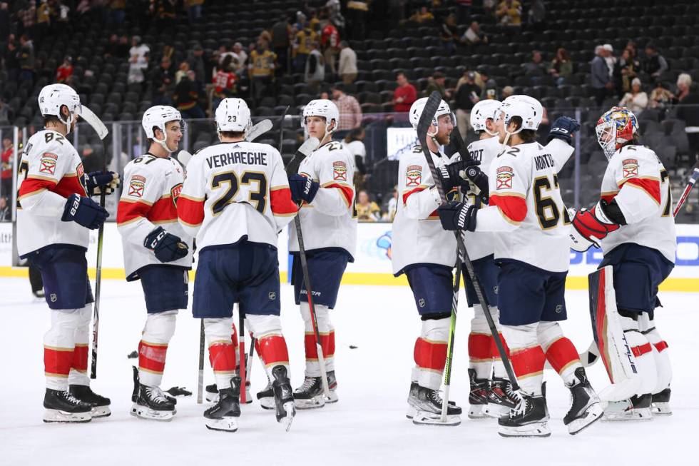 The Florida Panthers celebrate after defeating the Vegas Golden Knights during an NHL game Thur ...