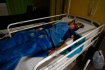 Mahdieh Sazmand who was wounded in Wednesday's bomb explosion lies on bed at Bahonar hospital i ...