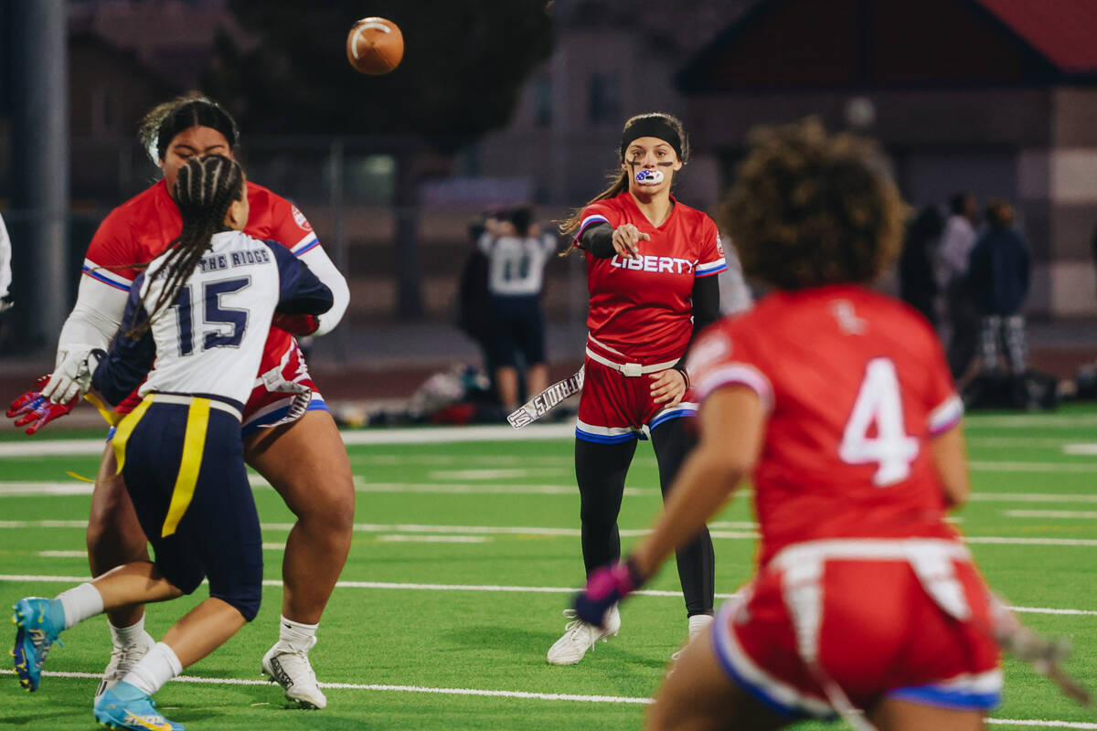 Liberty quarterback Kaylie Phillips (14) throws the ball during a game against Shadow Ridge at ...