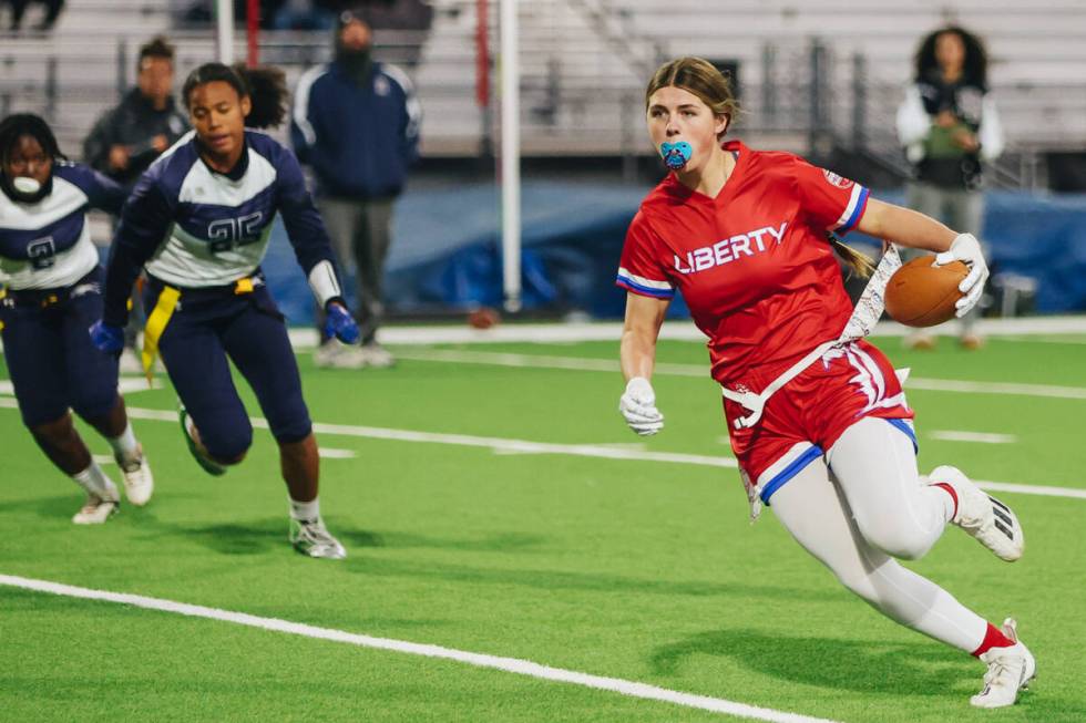 Liberty flag football wide receiver Brinlee Yurek carries the ball during a game against Shadow ...