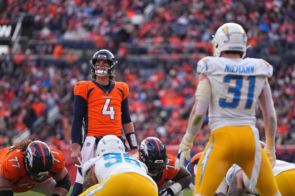 Denver Broncos quarterback Jarrett Stidham (4) against the Los Angeles Chargers of an NFL footb ...