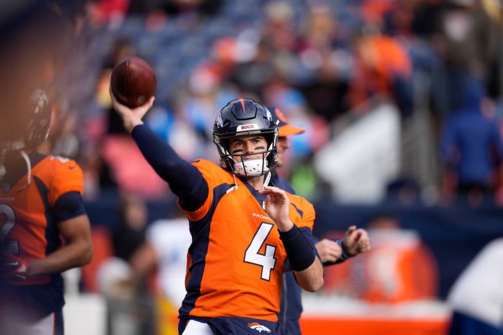 Denver Broncos quarterback Jarrett Stidham (4) before an NFL football game in Empower Field at ...