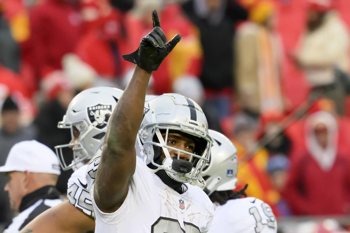 Las Vegas Raiders running back Zamir White celebrates after they beat the Kansas City Chiefs in ...