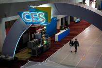 People walk through the Las Vegas Convention Center during setup ahead of the CES tech show Sat ...