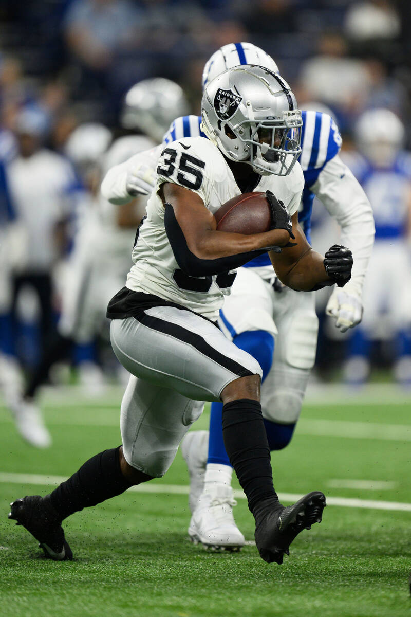 Las Vegas Raiders running back Zamir White (35) runs to the outside during an NFL football game ...