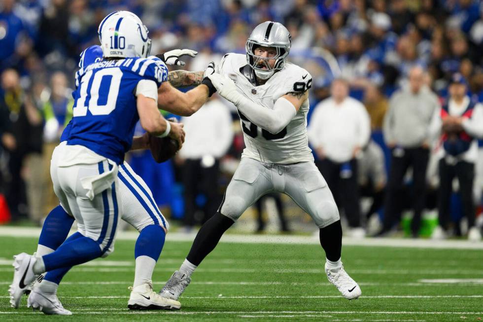 Las Vegas Raiders defensive end Maxx Crosby (98) rushes around the edge during an NFL football ...