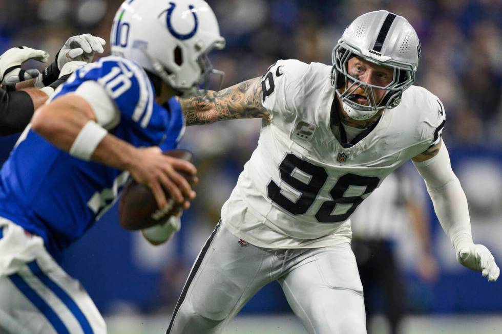 Las Vegas Raiders defensive end Maxx Crosby (98) gets pressure on Indianapolis Colts quarterbac ...