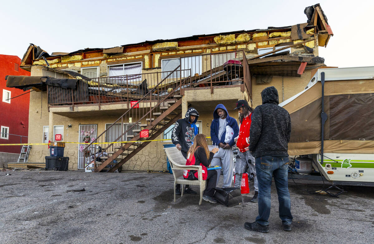 The Red Cross assists those displaced by an apartment building roof collapse near Carey Avenue ...