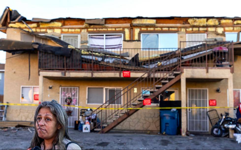 Downstairs resident Katherine Lufk in front of her apartment building which has a roof collaps ...