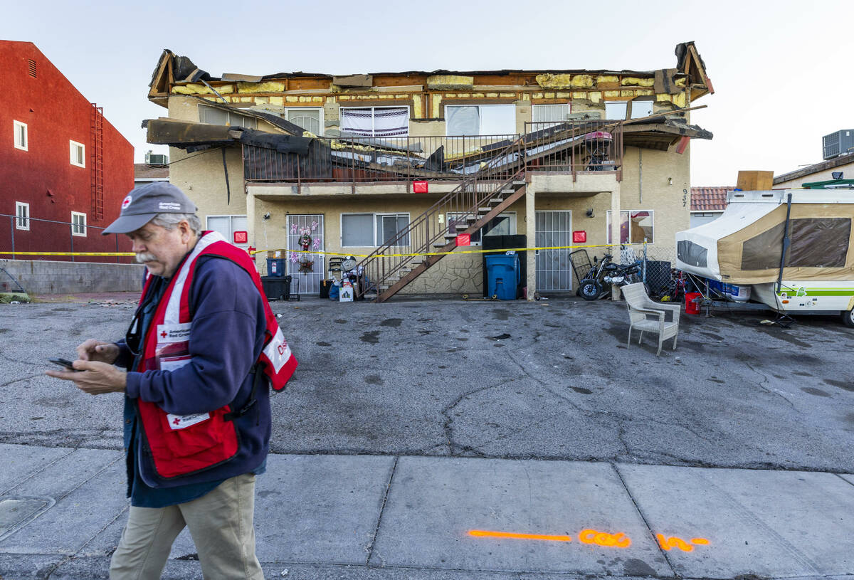 The Red Cross assists those displaced by an apartment building roof collapse near Carey Avenue ...