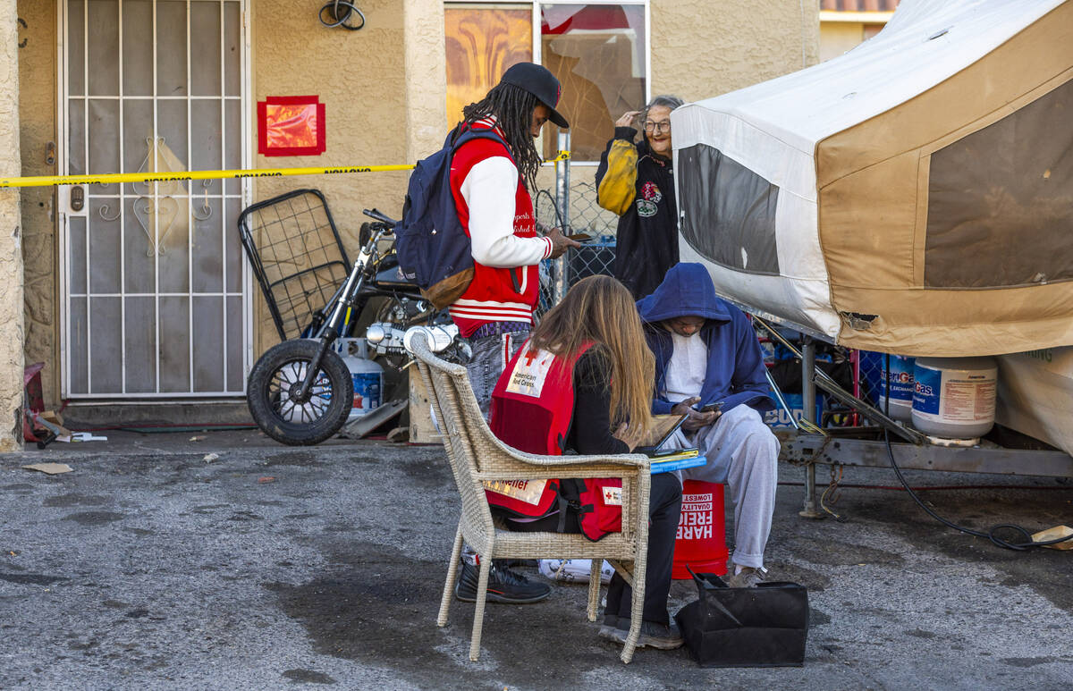 The Red Cross assists those displaced by an apartment building roof collapse near Carey Avenue ...