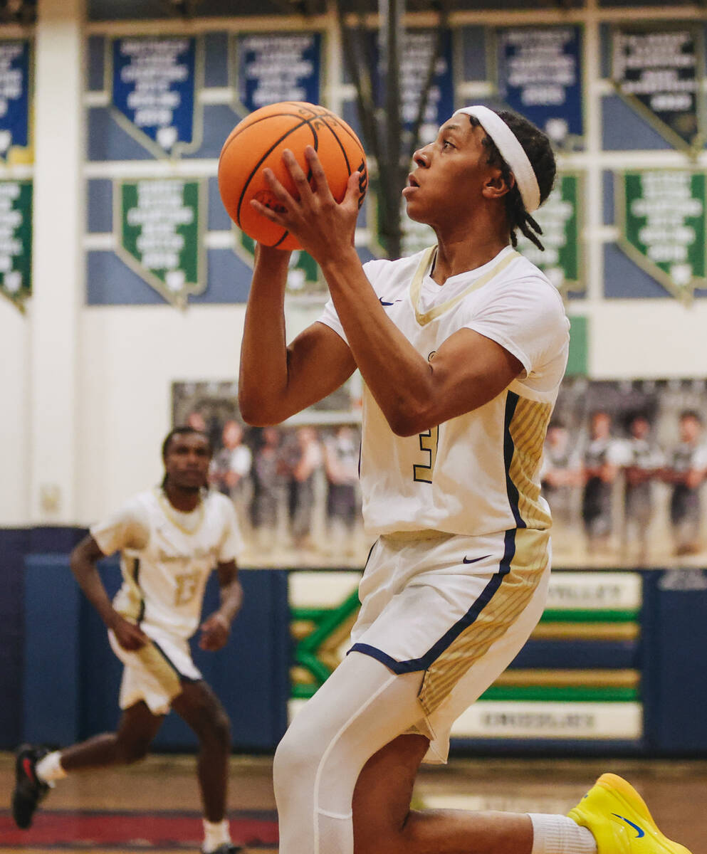 Spring Valley point guard Jamo Mccall positions himself to shoot the ball into the basket durin ...